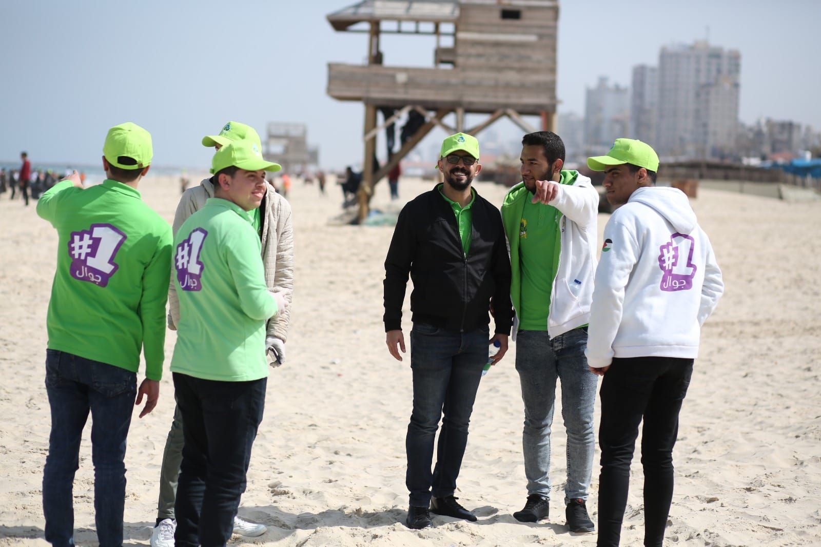 With Ana Jawwal volunteers on the beach during a clean-up campaign