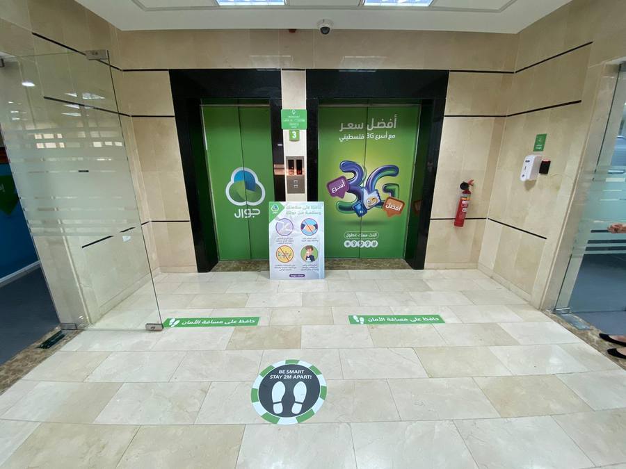 Elevator branding and COVID-19 safety signage at headquarters · 2020